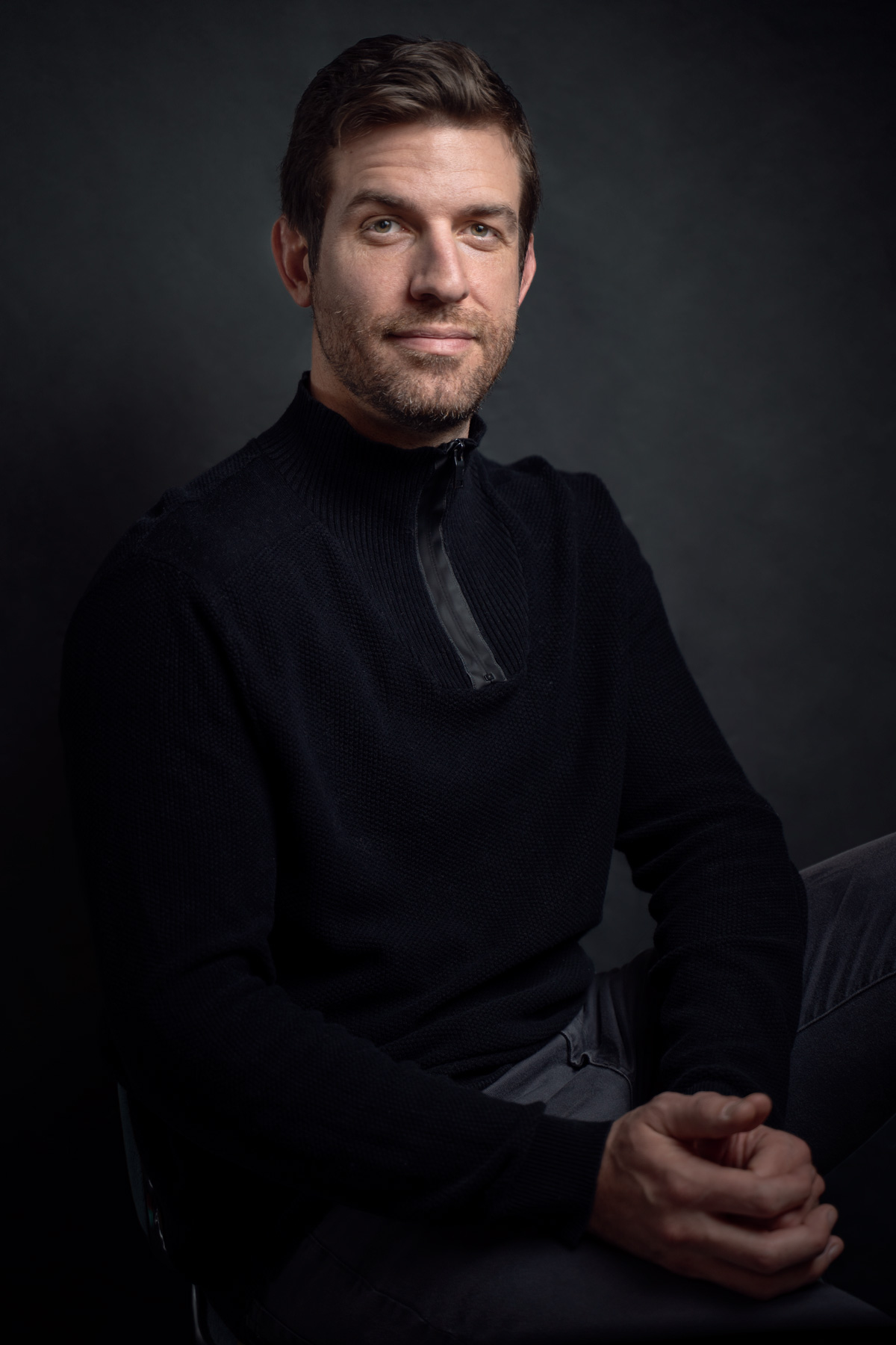 Leif Derrickson portrait in a zip up black turtleneck